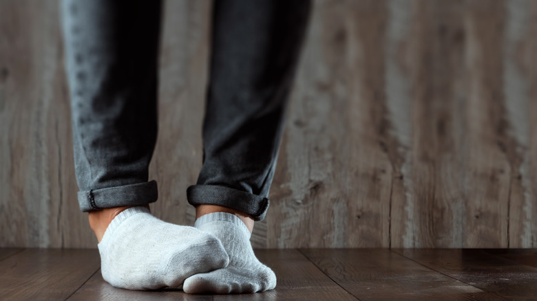 Person with smelly socks