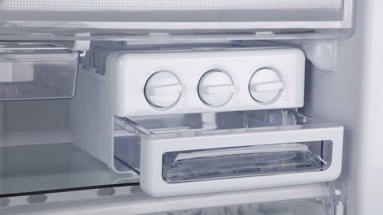 Inside refrigerator ice maker