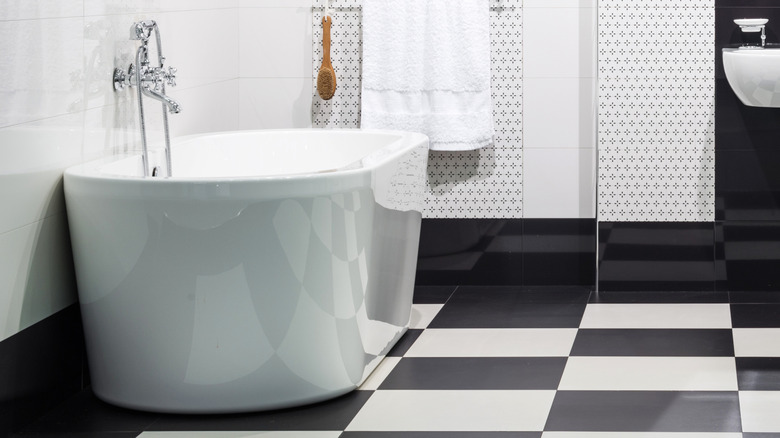 A bathroom with checkered tile