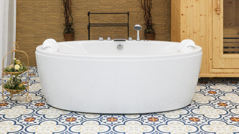 A bathroom with colorful tile floor