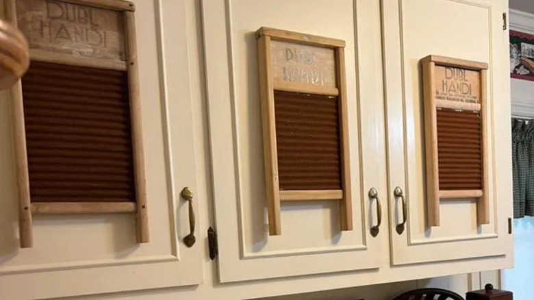 retro washboards on the cabinet doors in a laundry room