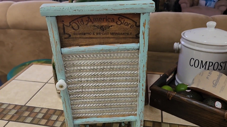 An old washboard door with a knob attached to the front