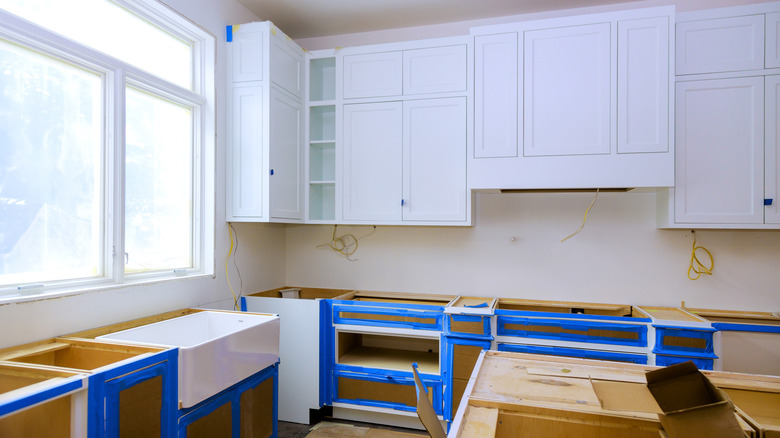 kitchen with masking tape ready to paint
