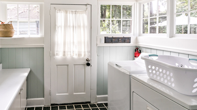Vintage-inspired laundry room with white appliances