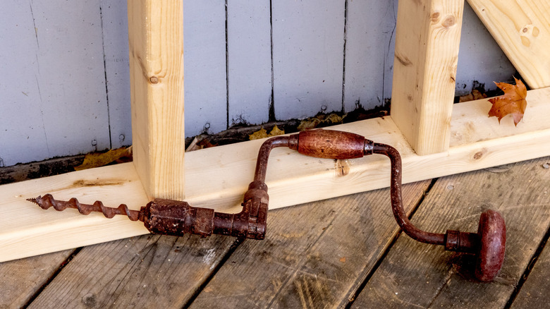 A manual hand drill, also called a wheel brace