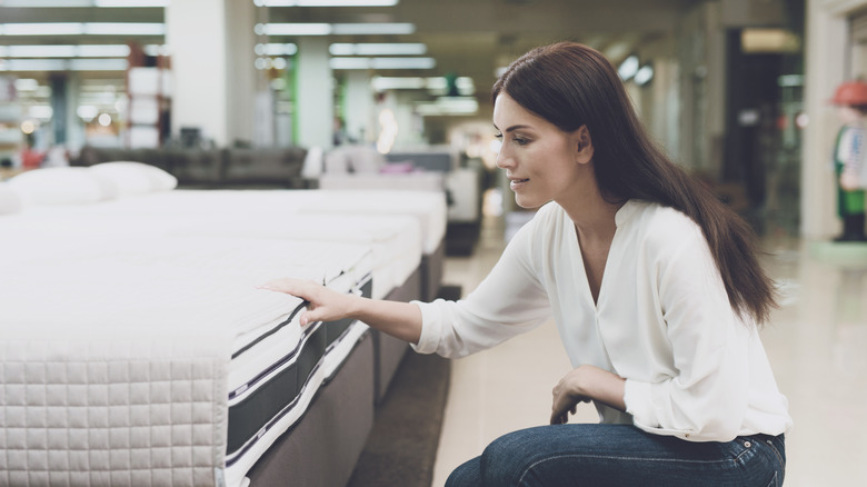 woman tests mattress