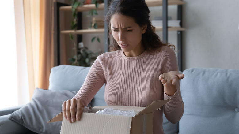 Woman confused with package