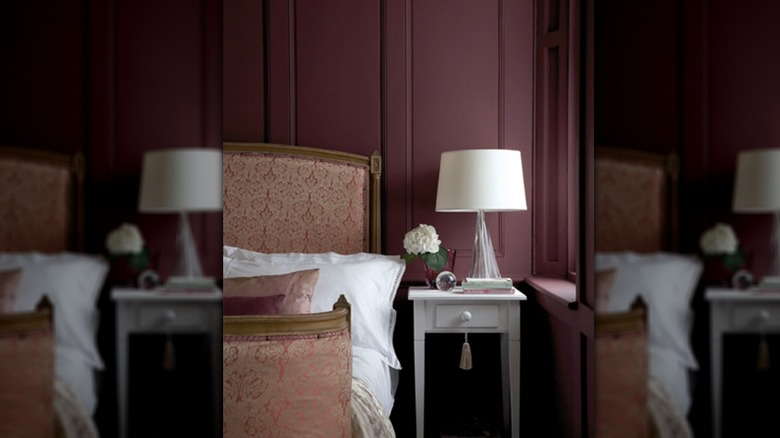 Little Greenes plum shade for the year, called Adventurer, on the walls of a bedroom