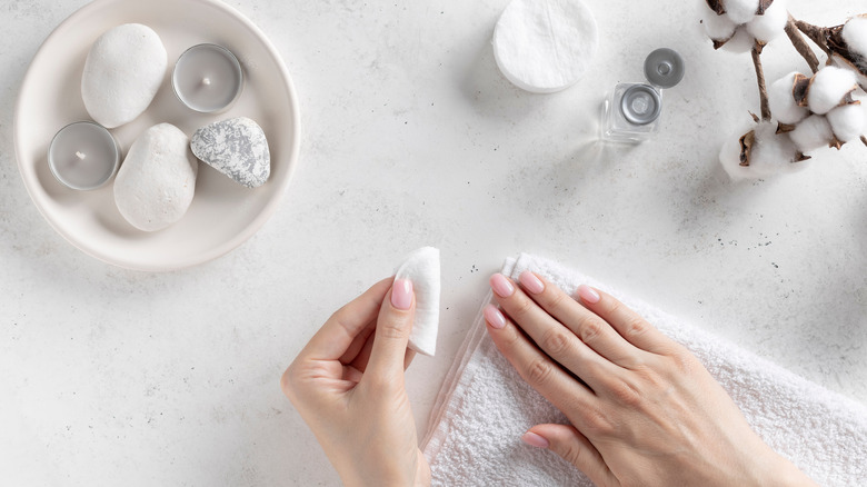 Woman removing nail polish