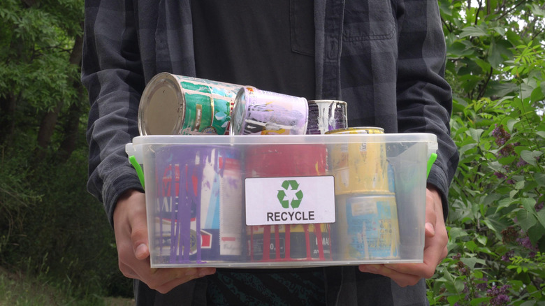 Person disposing of oil paint