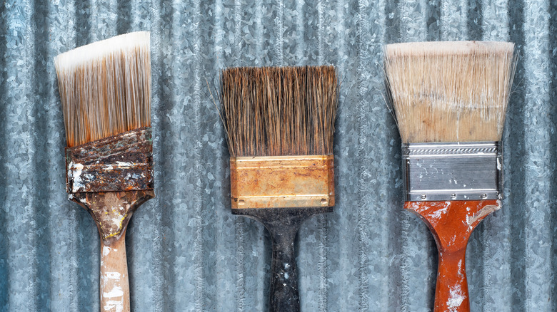 three paint brushes 