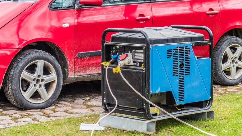 red car behind blue generator