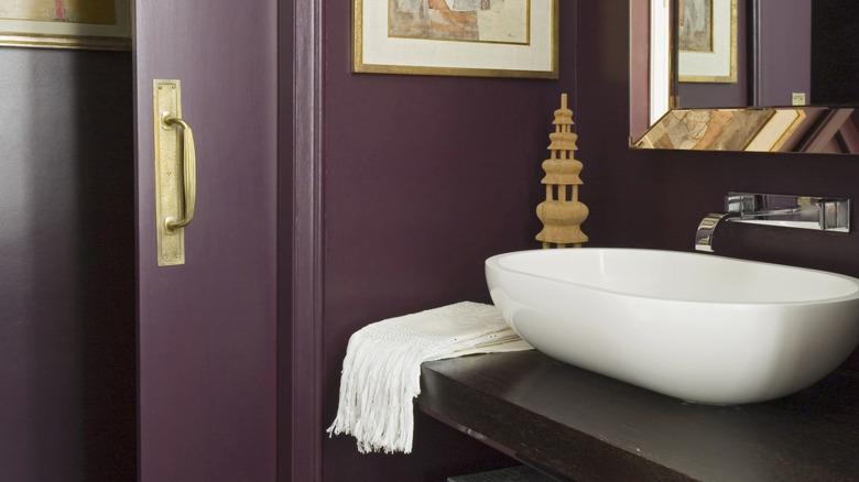 Deep plum room paint with gold accents