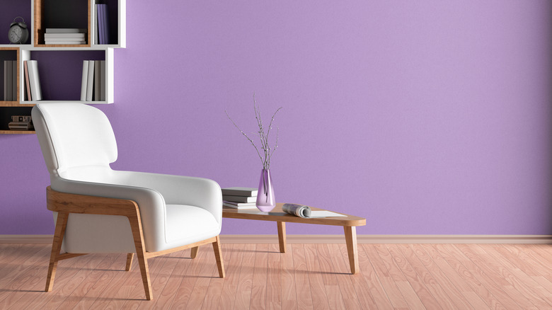 Purple wall paint with neutral and wood furnishings