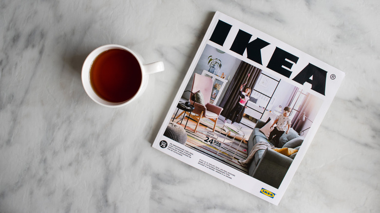 An Ikea magazine with cup of coffee