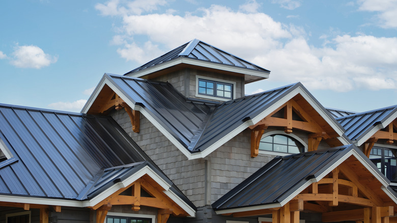 Close-up of a home with black roof