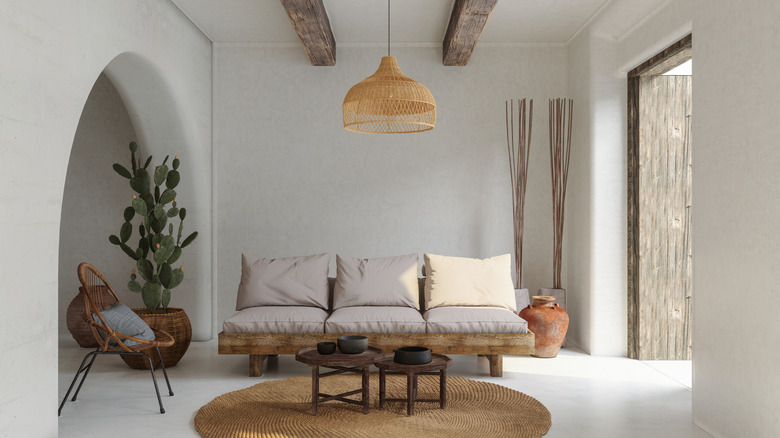 Modern rustic room interior with stone floors and exposed wooden beams
