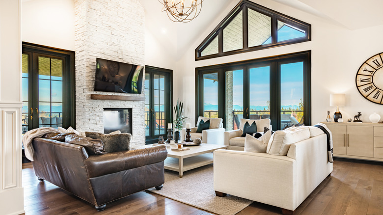 Modern farmhouse decor living room, white walls, leather couch and coffee table