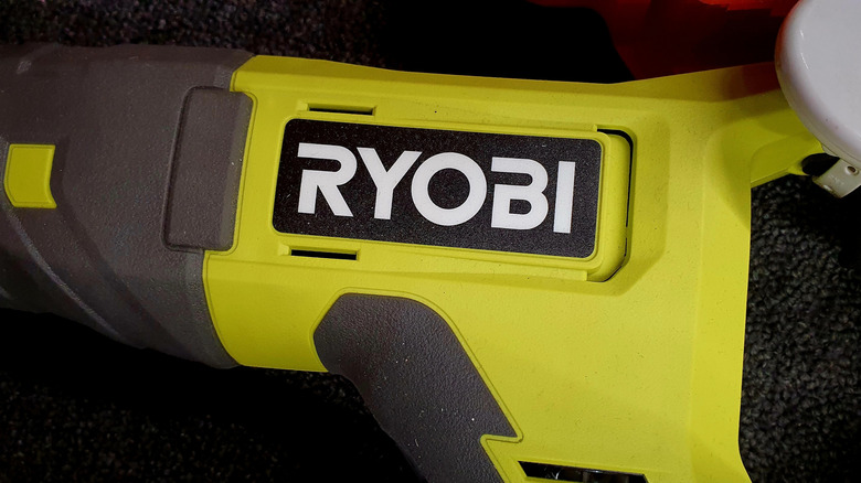 The Ryobi logo on the side of a tool.