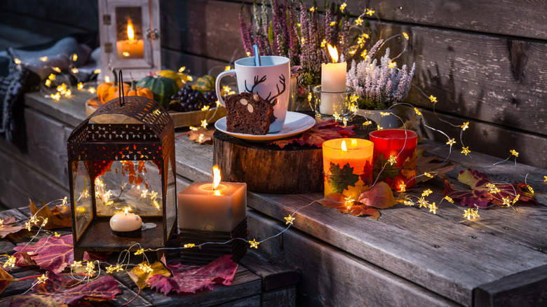 candles on wooden bench outside