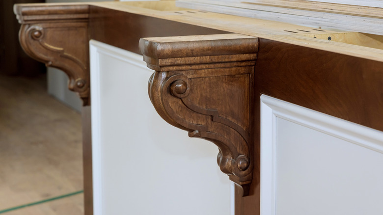 Corbels on the side of a kitchen island