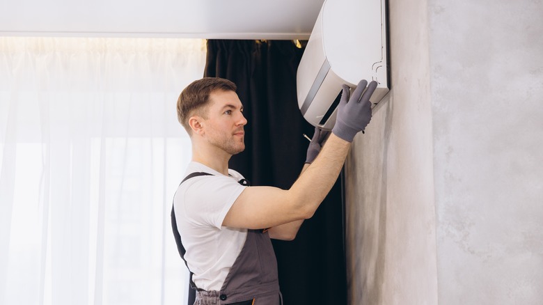 Technician working on HVAC system