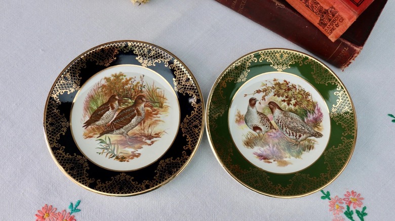 A set of mismatched fall-themed pheasant plates