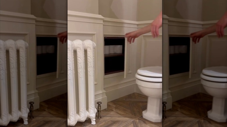 hidden storage compartment for toilet paper in bathroom on wainscoting