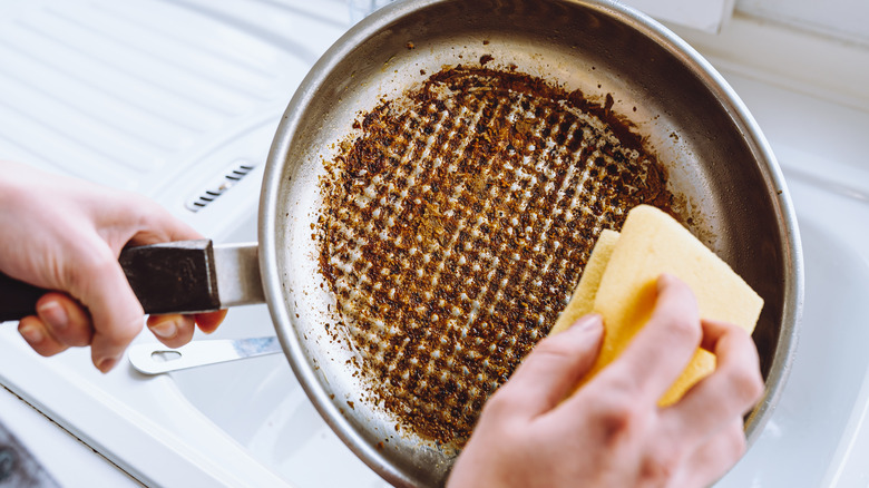 Hand washing scorched pan