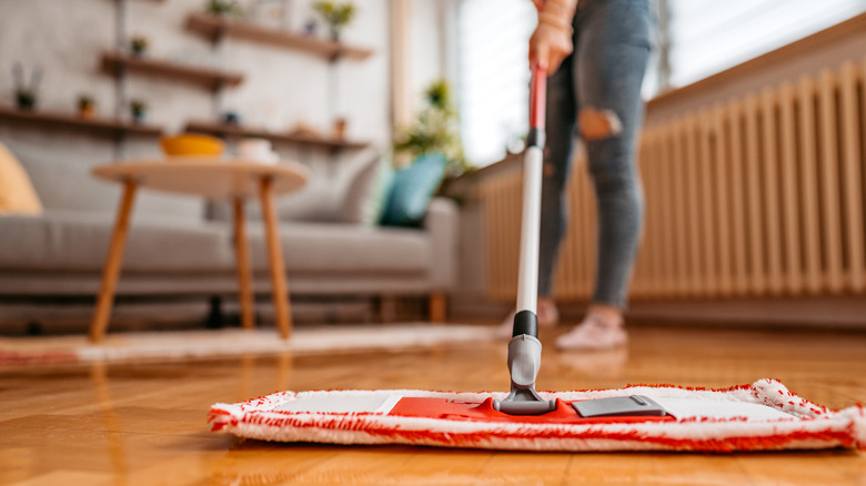 Woman cleaning wood floors