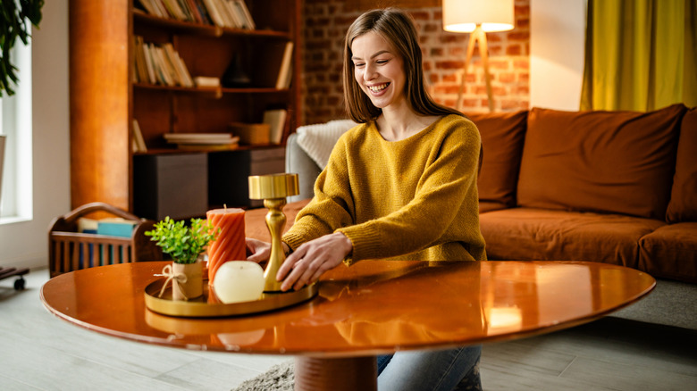 Someone decorating their coffee table