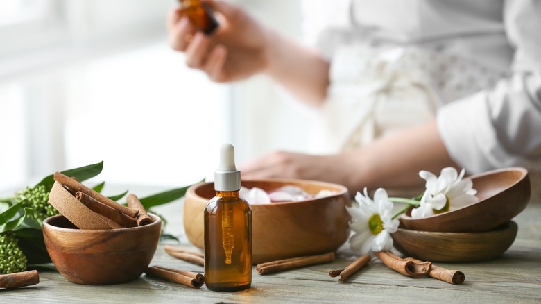 Cinnamon oil bottle on table