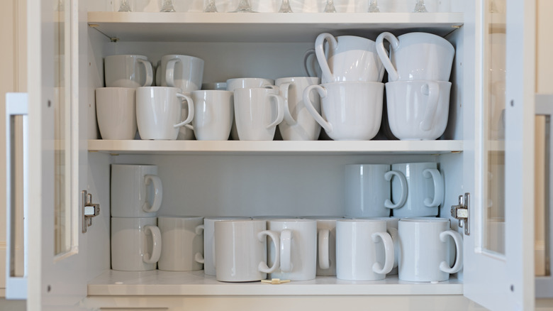 plates and mugs in drawer