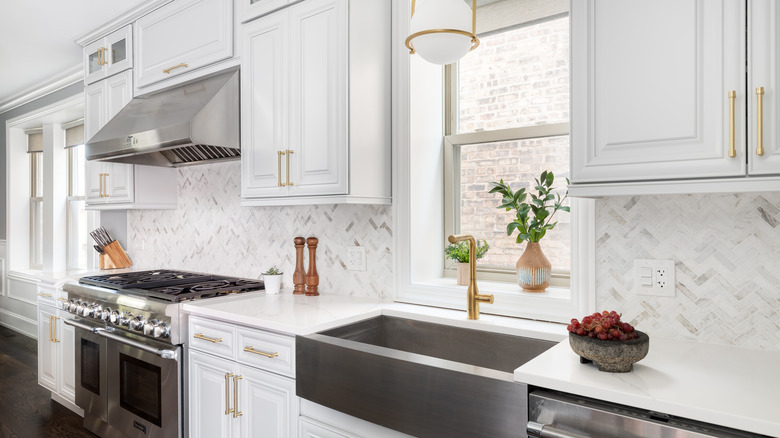 white cabinets with brass hardware