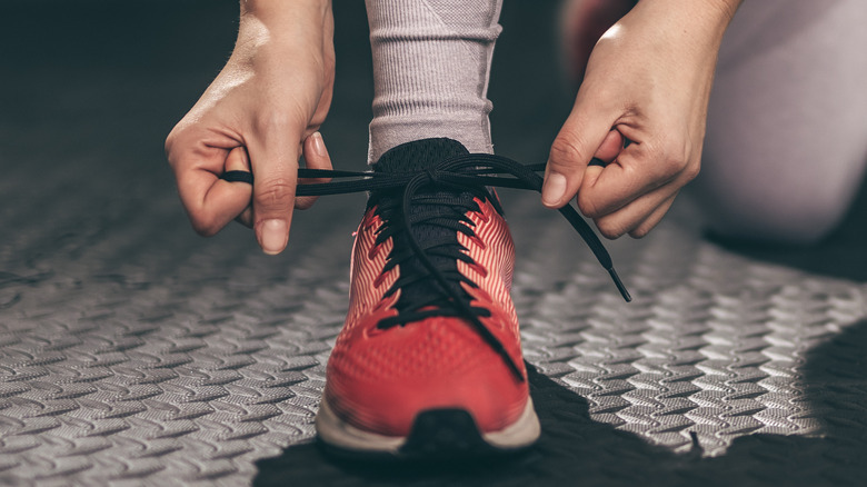 Person tying shoelaces