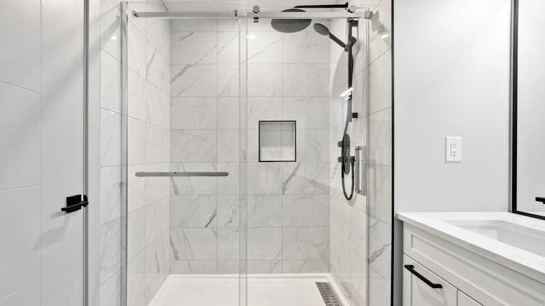 A modern bathroom with a sleek glass shower door