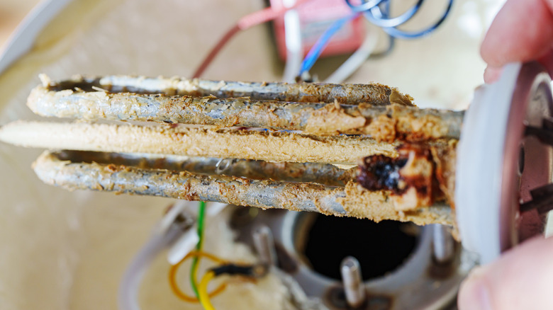 Close up of limescale buildup on water heater