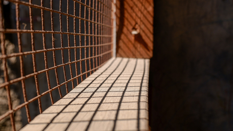 Close up of rusted hex netting fence
