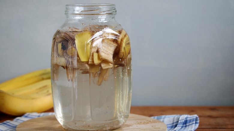Jar of banana soup on a wooden table