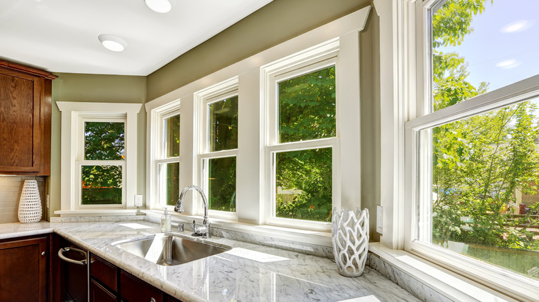 White, trimmed windows inside kitchen