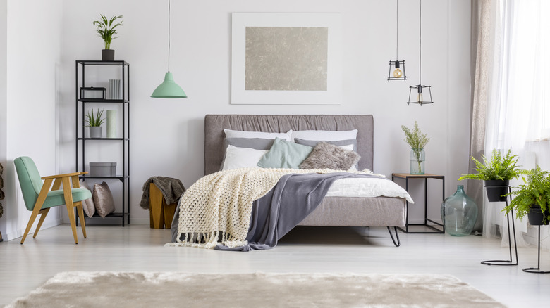 modern gray bedroom with pendant lighting