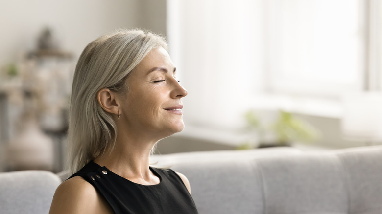 woman taking in good-smelling home