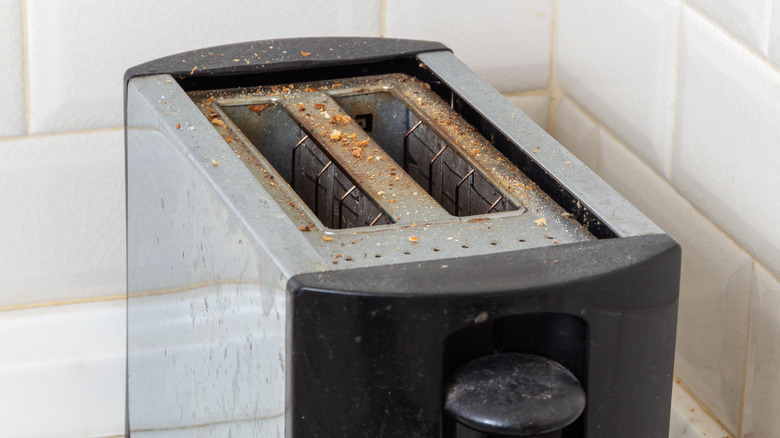 Crumb-covered toaster 