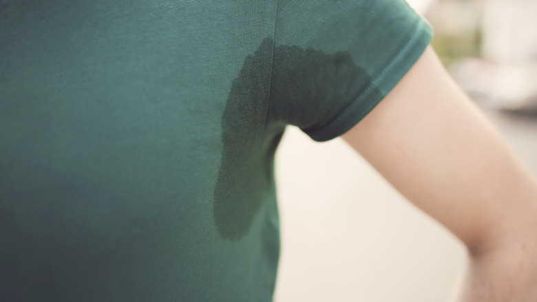 person with T-shirt sweat stain