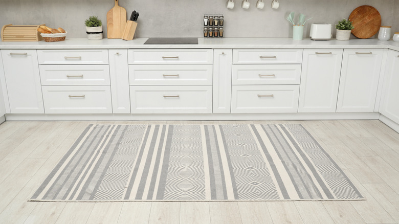 rug on wooden floor in kitchen