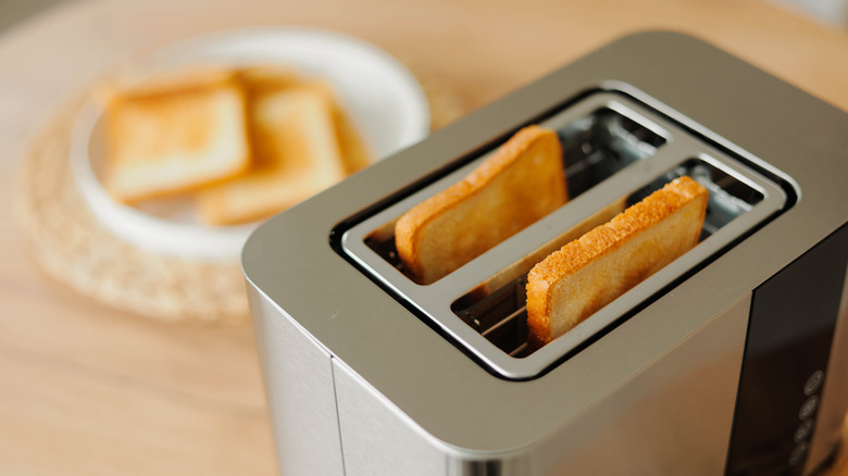 Toaster with two pieces of toast.