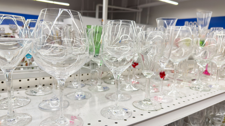 Thrift store shelf full of glassware
