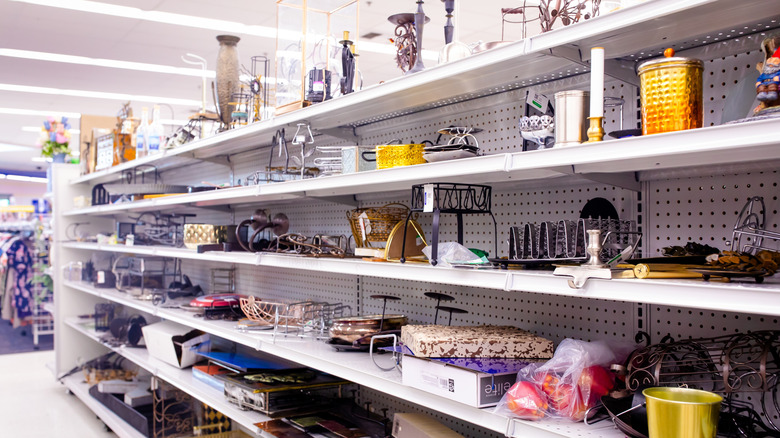 secondhand used donated goods on shelves at Goodwill thrift store.