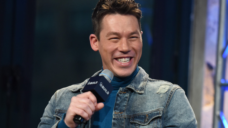 David Bromstad smiling with microphone