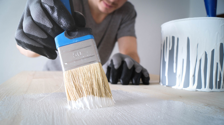 Person painting table